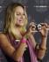 Actress Beau Garrett takes a picture of photographers as she arrives at the T-Mobile Sidekick LX Launch event in Los Angeles, Tuesday, Oct. 16, 2007. AP PhotoChris Pizzello