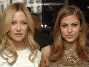 Actors Kate Hudson, left, and Eva Mendes pose for pictures at the opening of the new Dolce and Gabbana women apos;s store on Madison Avenue, Monday, Dec. 3, 2007, in New York. AP PhotoPeter Kramer
