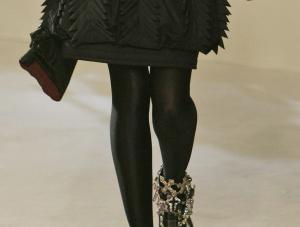 A model wears a Chanel creation by German fashion designer Karl Lagerfeld, during a fashion show in central London, Thursday Dec. 6, 2007.AP PhotoLefteris Pitarakis