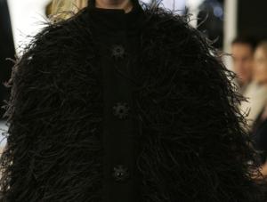 A model wears a Chanel creation by German fashion designer Karl Lagerfeld, during a fashion show in central London, Thursday Dec. 6, 2007. All the models apos; hairstyles are in the beehive style inspired by troubled British singer Amy Winehouse. AP PhotoLefteris Pitarakis